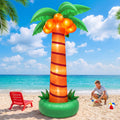 Tall palm tree inflatable with coconuts on a sandy beach