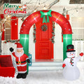 Red and green Christmas arch inflatable with Santa and a snowman at each side of a front door