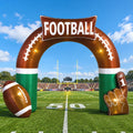 Brown FOOTBALL inflatable arch with a football and a #1 foam finger on a football field
