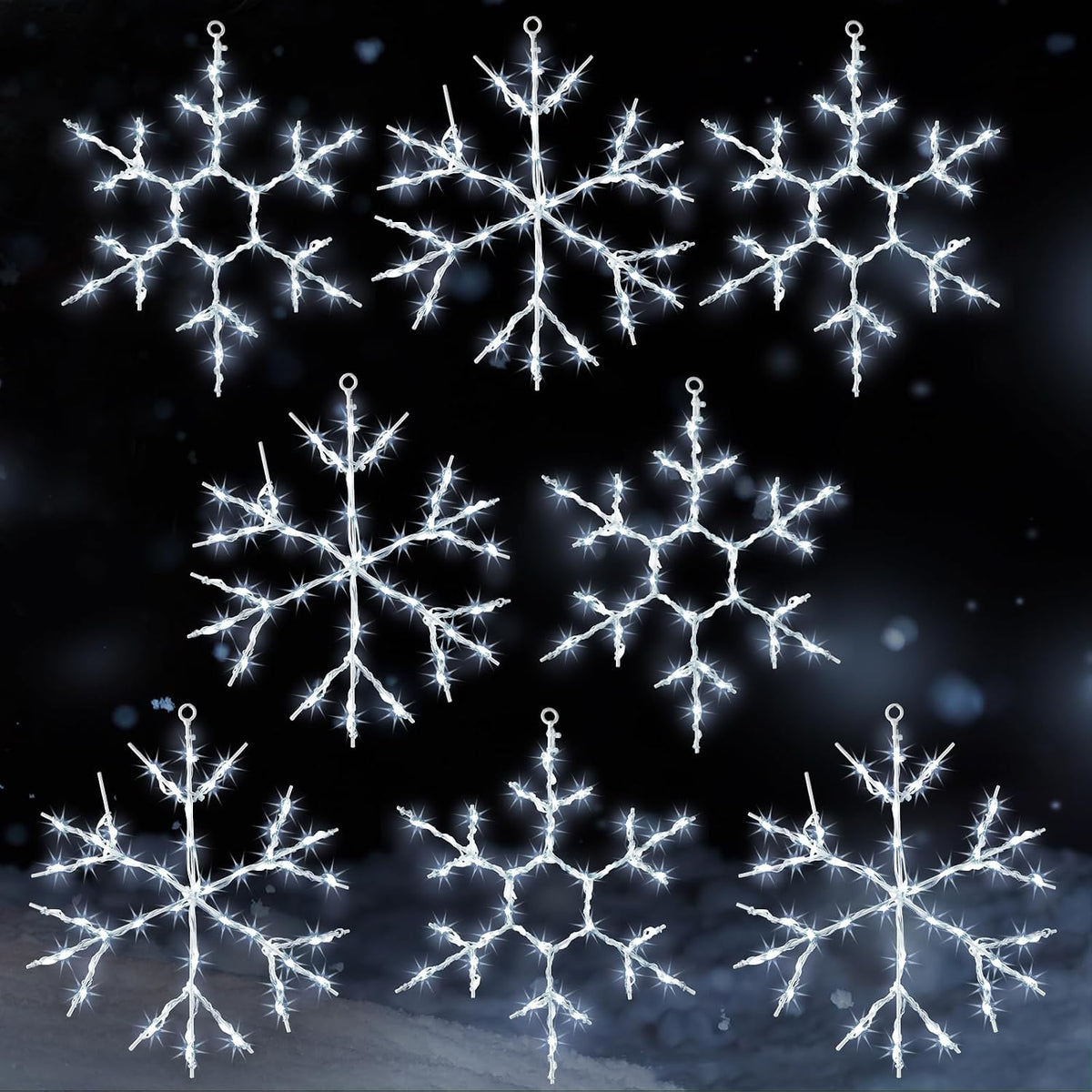 Eight cool white LED snowflake silhouette lights on a dark background