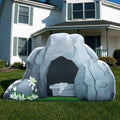 Gray empty tomb inflatable with the stone rolled away and white lilies on a front lawn